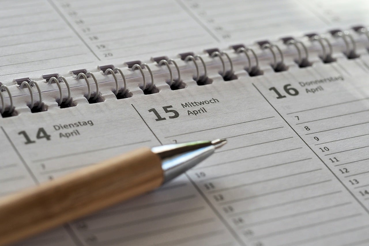 Calendar and planning notebook showing operational time savings